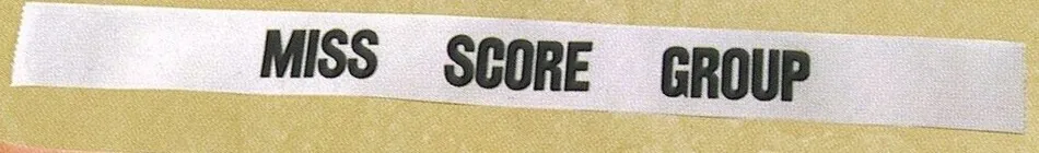 White sash printed Miss Score Group in black